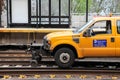 Yellow Metro North Railroad pick up truck on railway near Norwalk station