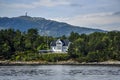 Norway coast with charming cottages in the background, summer, s Royalty Free Stock Photo