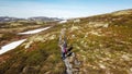 Norway - A couple hiking in the highland plateau
