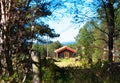 Norway distant farm house in woods background Royalty Free Stock Photo