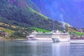 Norway fjord landscape and cruise ships in Olden