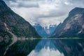 Norway fjord scenic landscape of Eidfjord with mountain reflections on the water. Royalty Free Stock Photo