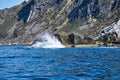 norway on the fjord, spray on rocks. Water splashes on the stones. Coastal landscape Royalty Free Stock Photo