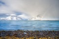 Norway fjord winter landscape with rainbow ,polar circle whether Royalty Free Stock Photo