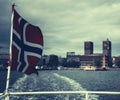 Norway flag on the ferry, view of Oslo city hall, Scandinavia Royalty Free Stock Photo