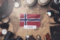 Norway Flag Between Traveler`s Accessories on Old Vintage Map. Overhead Shot Royalty Free Stock Photo