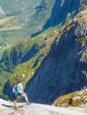 Norway - A girl hiking high in the mountains