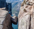 Norway - A girl standing on Kjerag with view on Lysefjorden