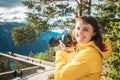 Norway. Happy Young Caucasian Woman Lady Tourist Traveler Photographer Taking Pictures Photos Near Stegastein Viewpoint Royalty Free Stock Photo