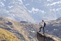 Norway hike, young woman traveler with backpack standing on the