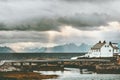 Norway Landscape white traditional house at sunset sea and mountains on background Travel