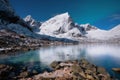 Norway, Lofoten island. Mountains and reflections on water at night. Winter landscape. The sky with stars and Aurora borealis. Nat Royalty Free Stock Photo