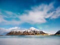 Norway, Lofoten island. Mountains and reflections on water at night. Winter landscape. The sky with stars and Aurora borealis. Nat Royalty Free Stock Photo