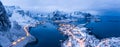 Norway Lofoten Reine aerial panoramic landscape in winter time with rainbow and mountains covered in snow