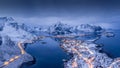 Norway Lofoten Reine aerial panoramic landscape in winter time with rainbow and mountains covered in snow