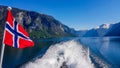 Norway - Norwegian flag waving above the water. Royalty Free Stock Photo