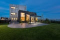 Norway Oslo - July 21 2021: Modern Luxury mansion exterior in the garden, dusk shot