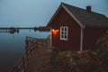 Norway rorbu houses and mountains rocks over fjord landscape scandinavian travel view Lofoten islands. Night landscape Royalty Free Stock Photo