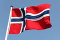 Norway. Norwegian Flag in a Blue Sky. Proud to express loyalty a Royalty Free Stock Photo