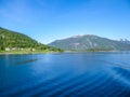 Norway - Slightly wavy surface of a fjord, surrounded by tall mountains Royalty Free Stock Photo