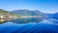 Norway - Slightly wavy surface of a fjord, surrounded by tall mountains Royalty Free Stock Photo