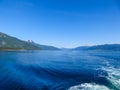 Norway - Slightly wavy surface of a fjord, surrounded by tall mountains Royalty Free Stock Photo