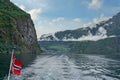 Norway, Sognefjord sea landscape with Norwegian flag Royalty Free Stock Photo