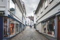 Norway, Stavanger, 07.30.2013 . Sad lonely elderly couple is on a deserted street . The horizontal frame.