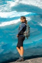 Norway Travel, Young Woman with a backpack admires Nigardsbreen Nigar Glacier arm of Jostedalsbreen located in Gaupne Jostedalen Royalty Free Stock Photo