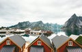 Norway village traditional houses roofs and mountain rocks over fjord Royalty Free Stock Photo