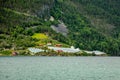 Norwegian agricultural farm with greenhouses on the hill at Naeroy fjord,  Aurlan, Sogn og Fjordane county, Norway Royalty Free Stock Photo
