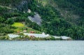 Norwegian agricultural farm with greenhouses on the hill at Naeroy fjord,  Aurlan, Sogn og Fjordane county, Norway Royalty Free Stock Photo