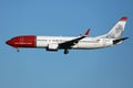 Norwegian Air Line plane flying to various destinations Royalty Free Stock Photo