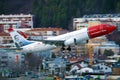 Norwegian Air Shuttle plane taking off from Innsbruck Airport, INN Royalty Free Stock Photo