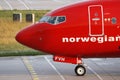 Norwegian Air Shuttle plane taxiing, close-up view Royalty Free Stock Photo