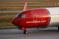 Norwegian Air Shuttle plane taxiing, close-up view Royalty Free Stock Photo