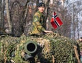 Norwegian Army armored tank with cannon and camouflage coating with soldier