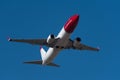 Norwegian Boeing B737-800 aircraft flying in the sky. Norwegian is a low-cost carrier airline