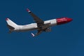 Norwegian Boeing B737-800 aircraft flying in the sky. Norwegian is a low-cost carrier airline