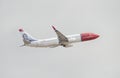 Norwegian Boeing 737 taking off from Tenerife south airport on a cloudy day. Royalty Free Stock Photo