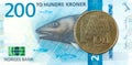 10 norwegian coin against new 200 norwegian krone bank note