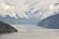 Norwegian fjord landscape with mountains and clouds. Sorfjorden. Norway.