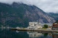 Norwegian fjord town and mountain a background. Norway. Royalty Free Stock Photo