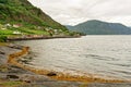 Norwegian fjords mountain picturesque landscape with rural houses, Norway