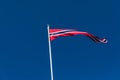 Norwegian flag against blue sky, Norway flag Royalty Free Stock Photo