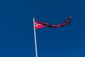 Norwegian flag against blue sky, Norway flag Royalty Free Stock Photo