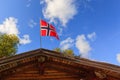 The norwegian flag against blue sky Royalty Free Stock Photo