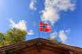 The norwegian flag against blue sky Royalty Free Stock Photo