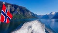 Norway - Norwegian flag waving above the water. Royalty Free Stock Photo