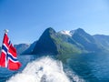 Norway - Norwegian flag waving above the water. Royalty Free Stock Photo